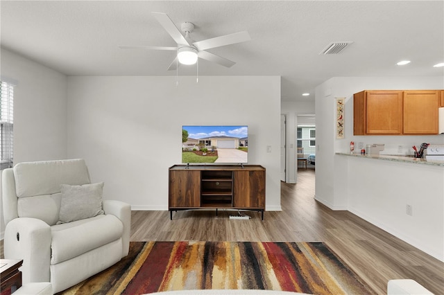 620 Vagabond St, The Villages, FL 32163 - living room with light wood-type flooring, visible vents, baseboards, and recessed lighting