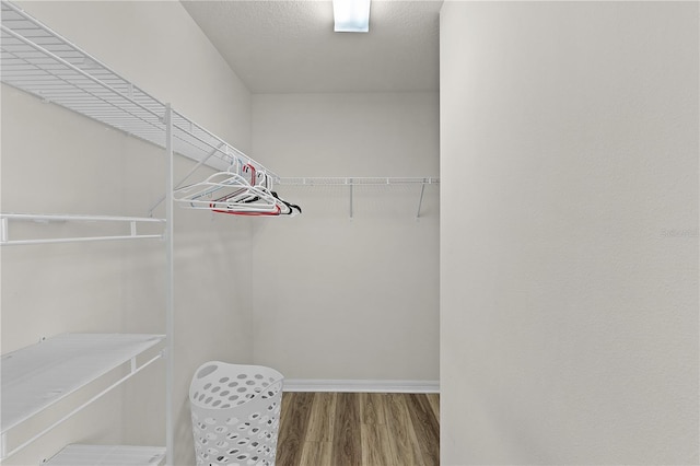 620 Vagabond St, The Villages, FL 32163 - spacious closet featuring wood finished floors
