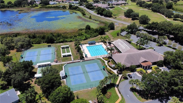 birds eye view of property with a water view