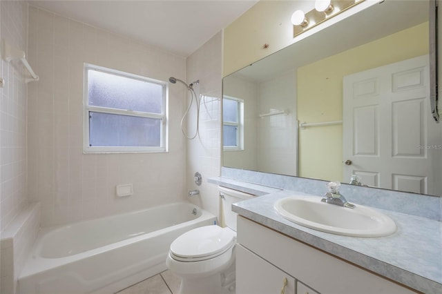 bathroom featuring shower / bathtub combination, vanity, toilet, and tile patterned floors