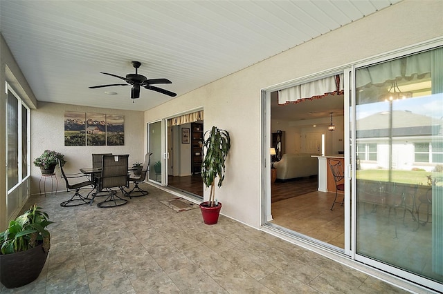 sunroom with a ceiling fan