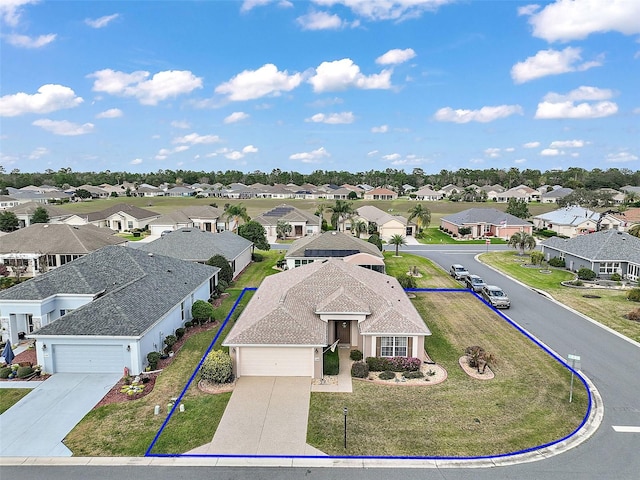 birds eye view of property with a residential view