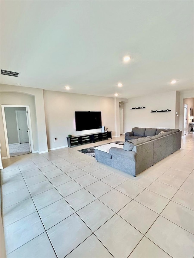 unfurnished living room featuring recessed lighting, visible vents, baseboards, and light tile patterned flooring