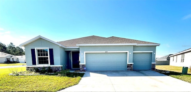 view of front of home featuring concrete driveway, stone siding, an attached garage, and a front yard