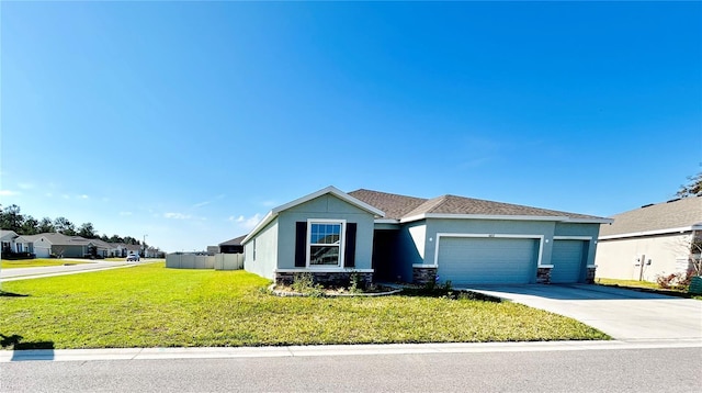 view of front of property featuring an attached garage, concrete driveway, stone siding, stucco siding, and a front yard