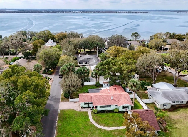 birds eye view of property with a water view and a residential view