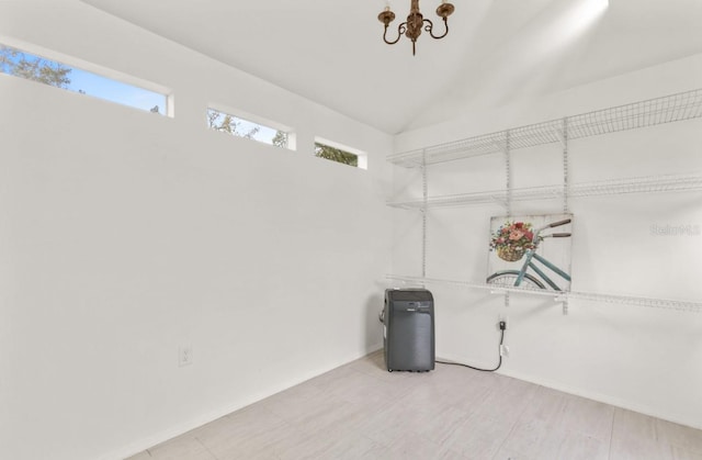 interior space with lofted ceiling and baseboards