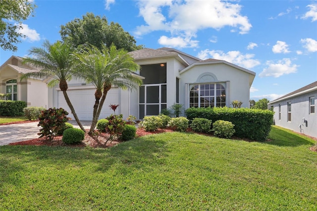4020 Capland Ave, Clermont, FL 34711 - view of front facade featuring an attached garage, stucco siding, a front lawn, and driveway