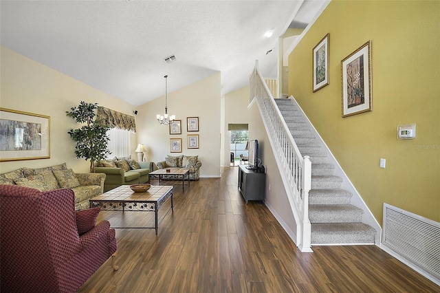 living room with dark wood-style floors, visible vents, stairway, and an inviting chandelier