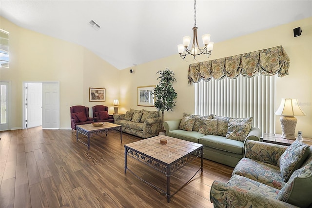 living room with dark wood-style floors, a wealth of natural light, and visible vents