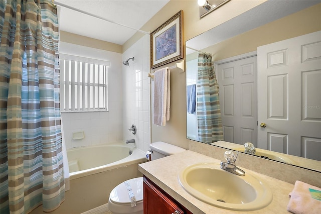 full bathroom featuring toilet, shower / bath combo with shower curtain, and vanity