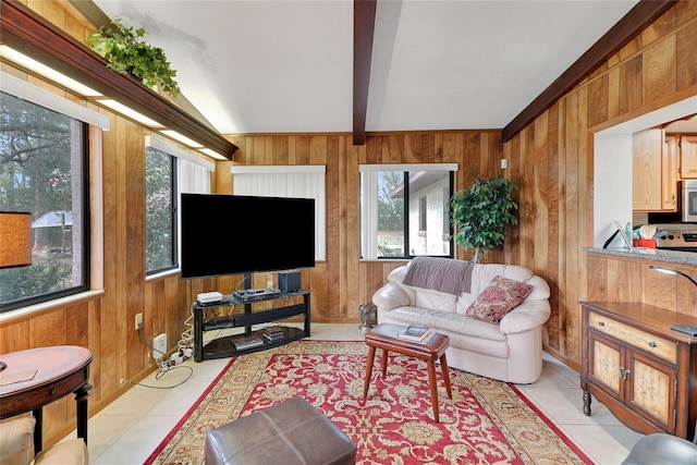 living area featuring lofted ceiling with beams, light tile patterned floors, and wooden walls