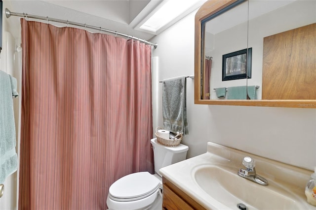 full bath featuring vanity and toilet