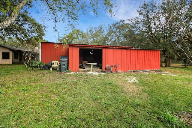 view of pole building with a lawn