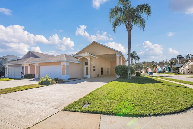 view of front of property featuring stucco siding, concrete driveway, a garage, a residential view, and a front lawn