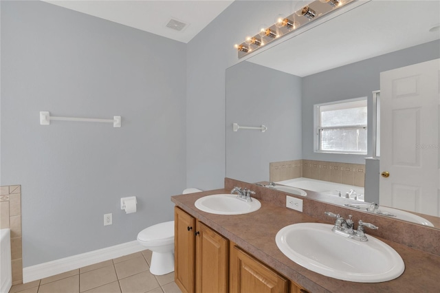 full bathroom with a bath, a sink, visible vents, and tile patterned floors