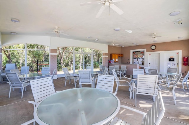 view of patio featuring a ceiling fan and outdoor dining area