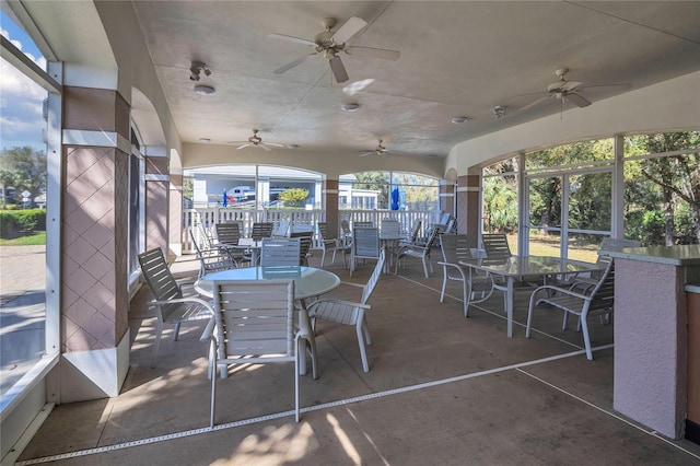 sunroom / solarium with ceiling fan