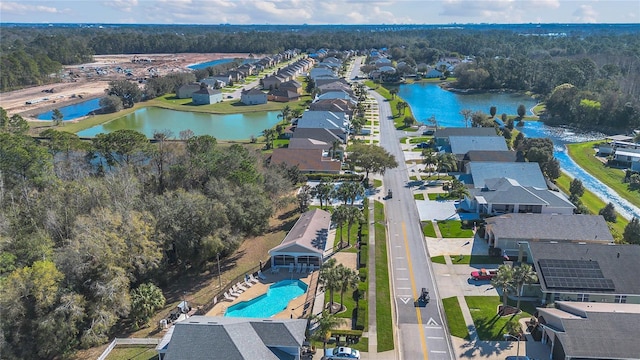 birds eye view of property with a residential view and a water view