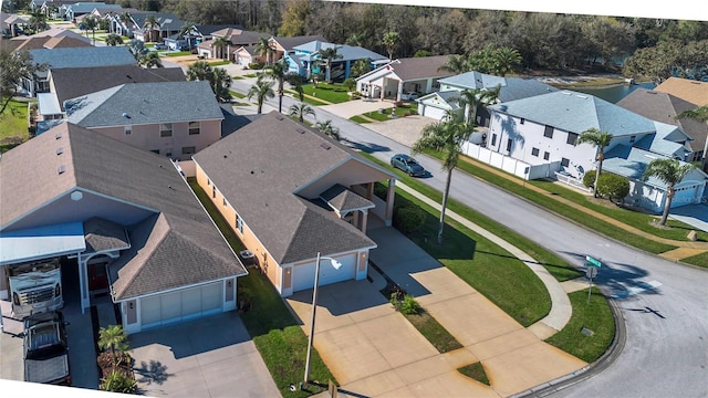 birds eye view of property with a residential view