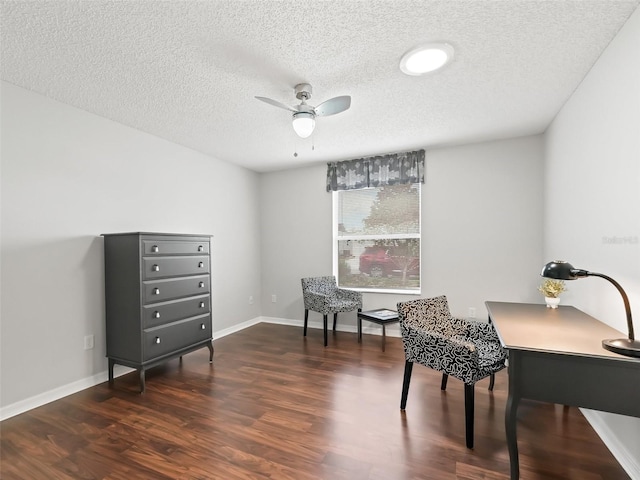 living area with baseboards, a textured ceiling, a ceiling fan, and dark wood-style flooring