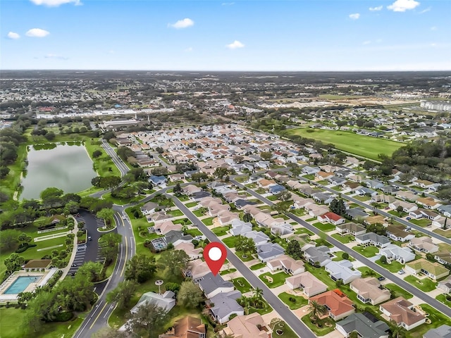 bird's eye view with a residential view and a water view