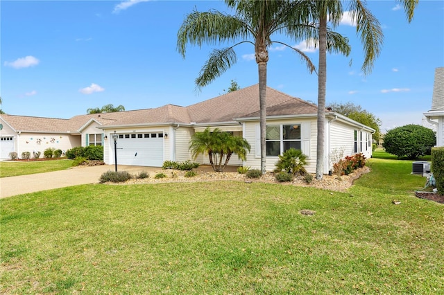 ranch-style home featuring driveway, a front lawn, and an attached garage