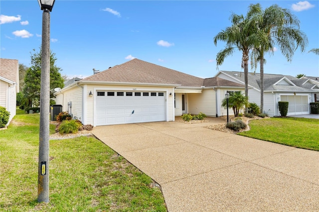 single story home featuring roof with shingles, concrete driveway, an attached garage, central AC unit, and a front yard