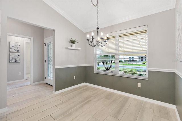 unfurnished dining area with crown molding, light wood-style flooring, vaulted ceiling, a chandelier, and baseboards