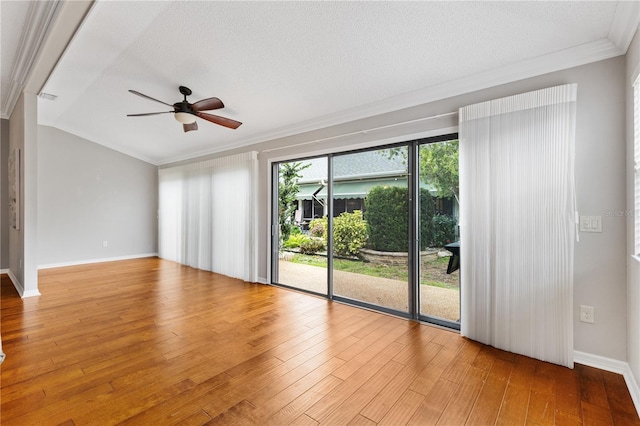 unfurnished room with crown molding, light wood finished floors, a ceiling fan, a textured ceiling, and baseboards