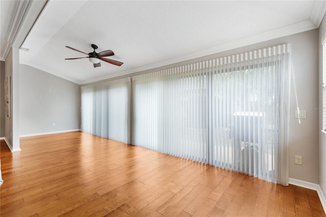 unfurnished room with ornamental molding, ceiling fan, light wood finished floors, and a textured ceiling