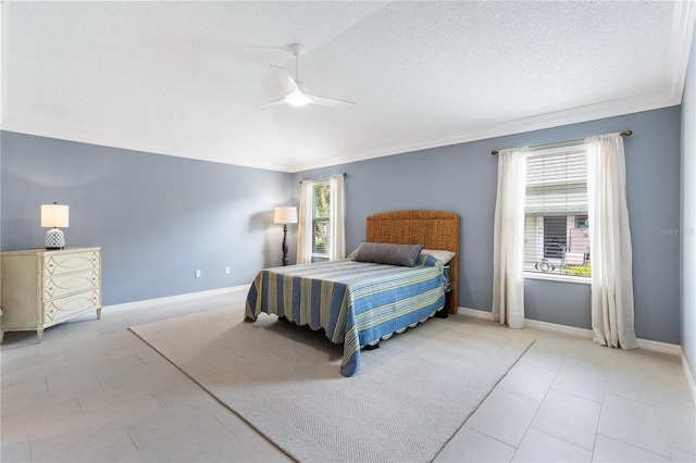 bedroom featuring ornamental molding, ceiling fan, a textured ceiling, and baseboards