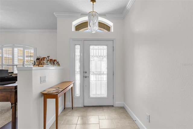 entrance foyer featuring baseboards, crown molding, and light tile patterned flooring