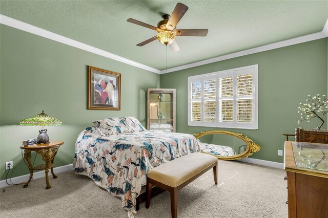 carpeted bedroom featuring crown molding, a textured ceiling, and baseboards