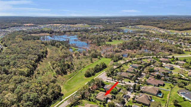 drone / aerial view with a water view and a residential view