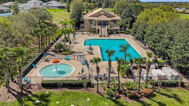 pool featuring a patio area and fence