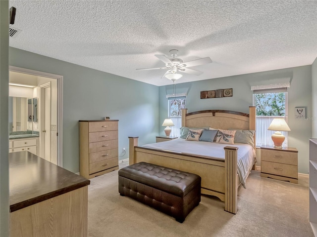 bedroom featuring visible vents, a textured ceiling, baseboards, and a ceiling fan