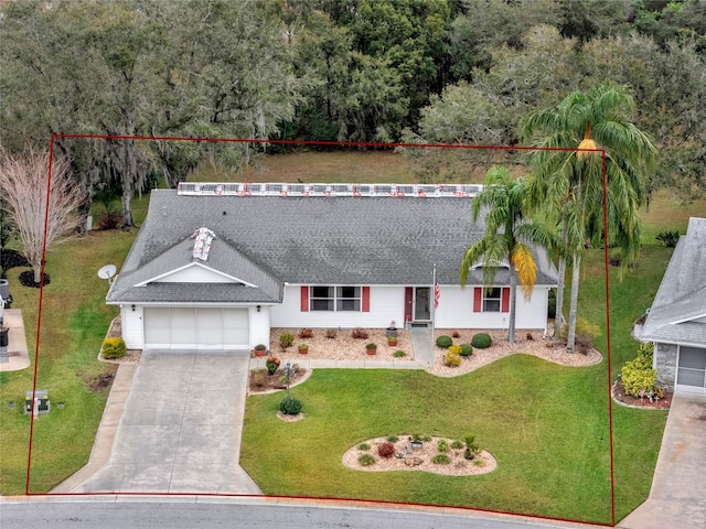 view of front of property featuring a garage, driveway, roof with shingles, and a front yard