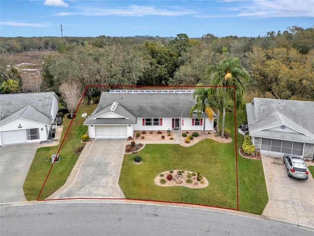 drone / aerial view with a wooded view