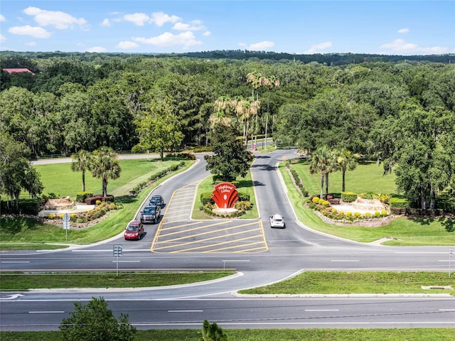 birds eye view of property featuring a view of trees