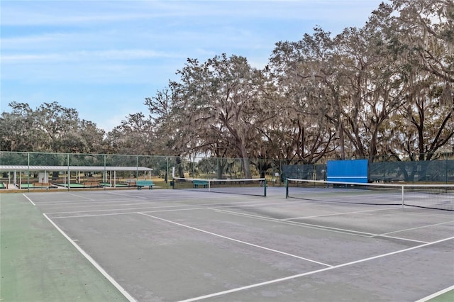 view of sport court with fence