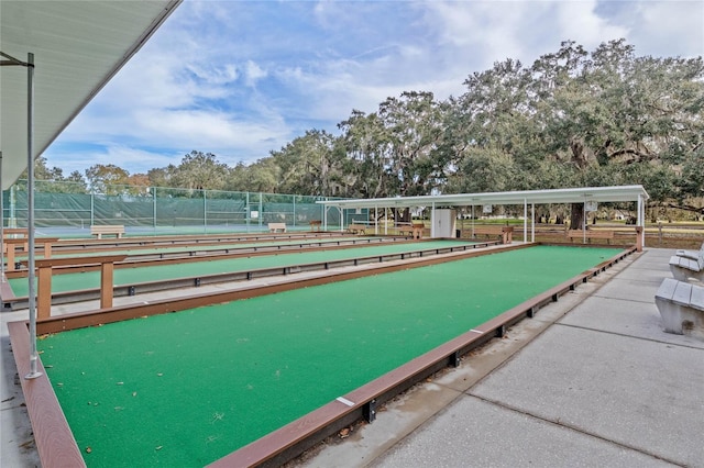 view of home's community with fence