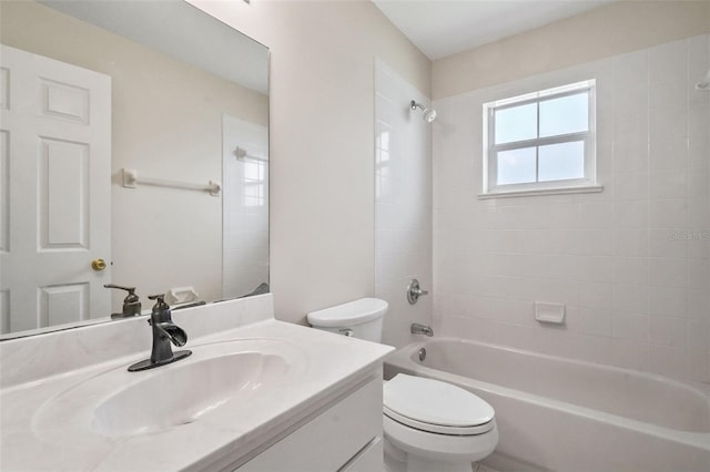 bathroom featuring tub / shower combination, vanity, and toilet