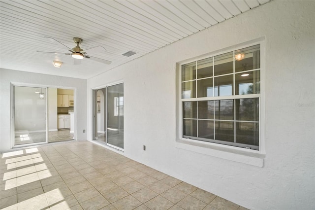 exterior space featuring ceiling fan and visible vents