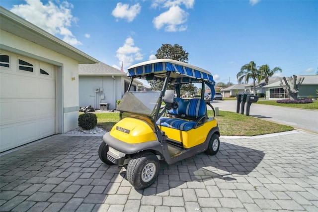 view of parking with an attached garage