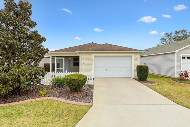 ranch-style home featuring roof with shingles, concrete driveway, an attached garage, a front yard, and fence