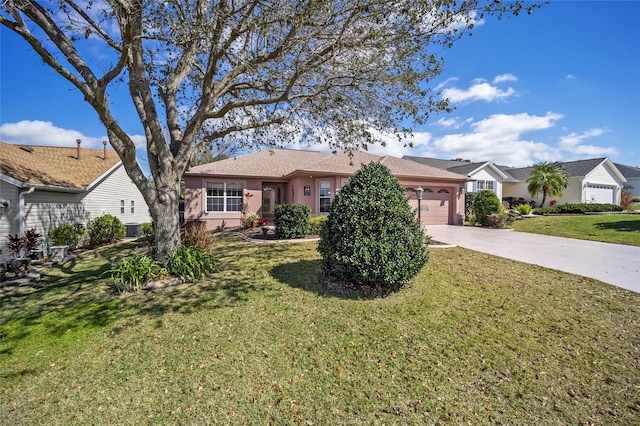 ranch-style home with a front lawn, an attached garage, and stucco siding