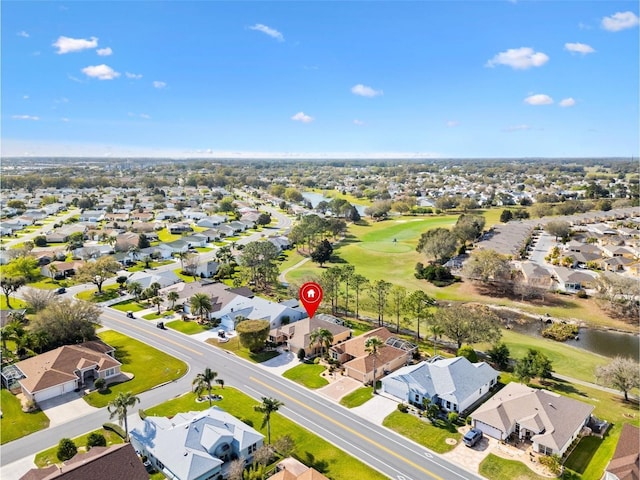 birds eye view of property featuring a residential view and view of golf course