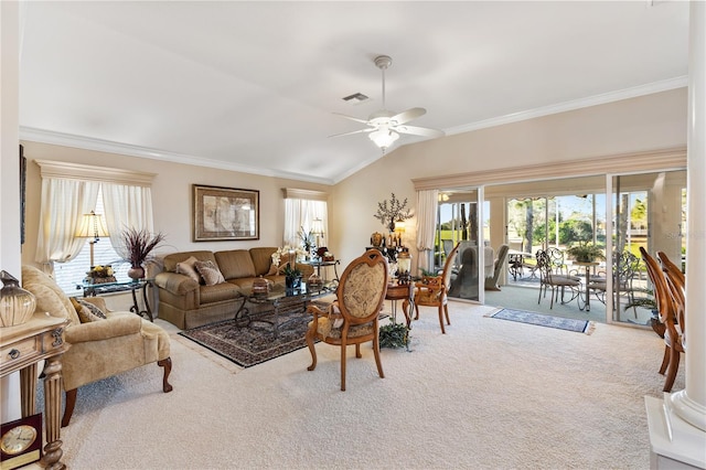 living area with lofted ceiling, carpet floors, a wealth of natural light, and crown molding