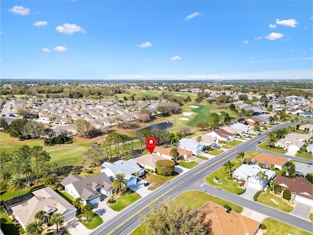 drone / aerial view with a residential view and view of golf course